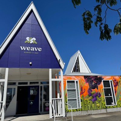 Weave Building sunny day Entry and mural